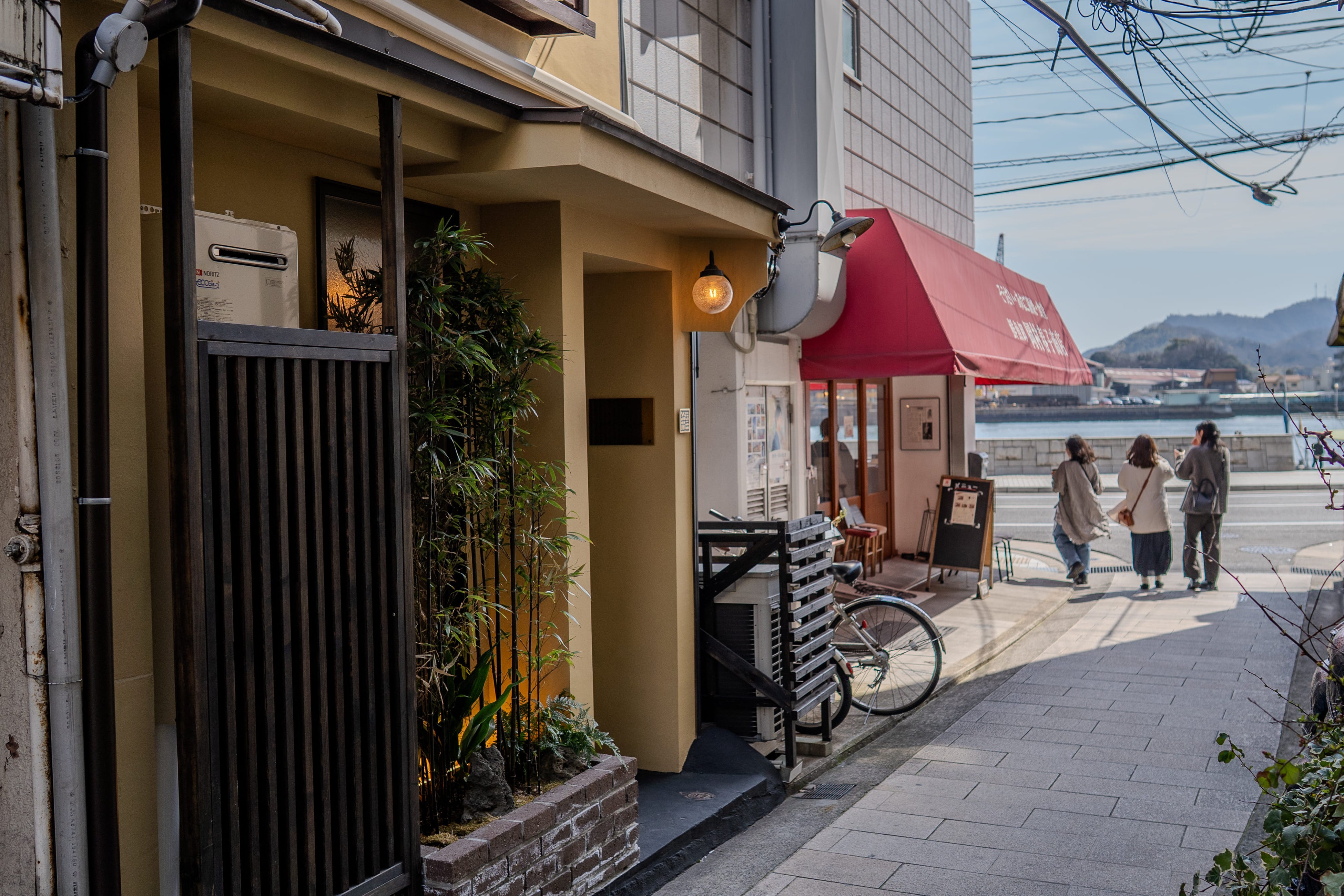 A renovated 140-year-old boathouse located on a seaside path near Onomichi Station
