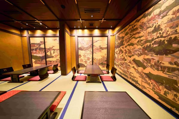 A wall covered edge to edge in paintings is a distinctive feature of the shop.