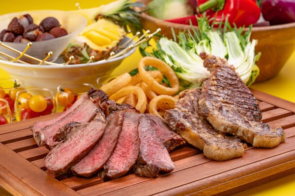 A juicy beef loin steak sizzling in the live kitchen, served with Okayama's Takatori Soy Sauce