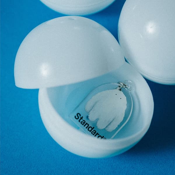 Yeti acrylic charm inside a capsule