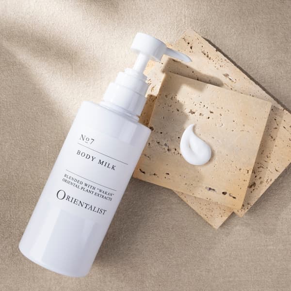 ORIENTALIST No.7 BODY MILK bottle and a swatch of the milk