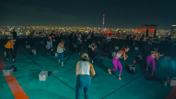 The open-air rooftop helipad with a city panorama