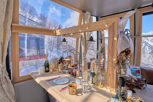 A special gondola in the style of a Swiss mountain hut, made with golden eagle wood