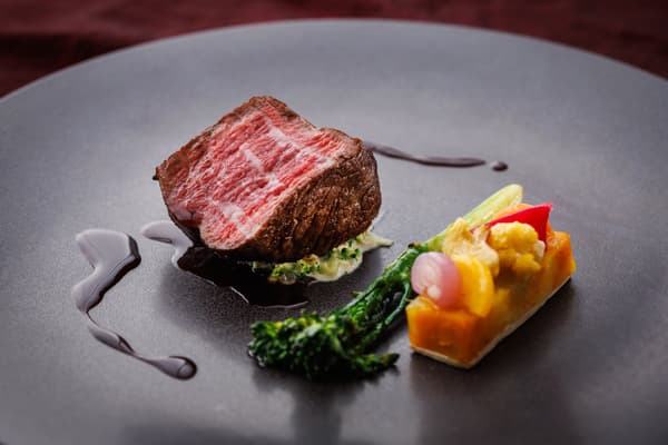 Black Wagyu beef fillet steak with nine colorful vegetables in a gâteau style