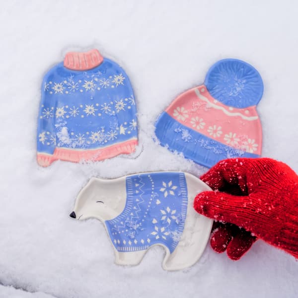 Knit, hat, and polar bear plates set out together