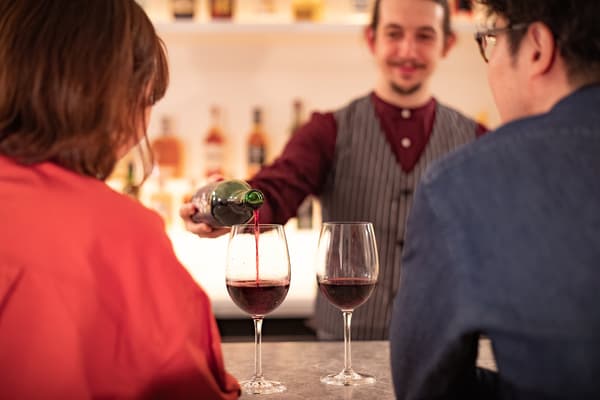 Hokkaido wines on display at Bar Ignis Otaru's backlit shelving