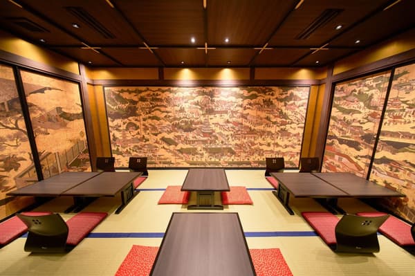 Sliding doors painted with goldfish open onto a different atmosphere inside.