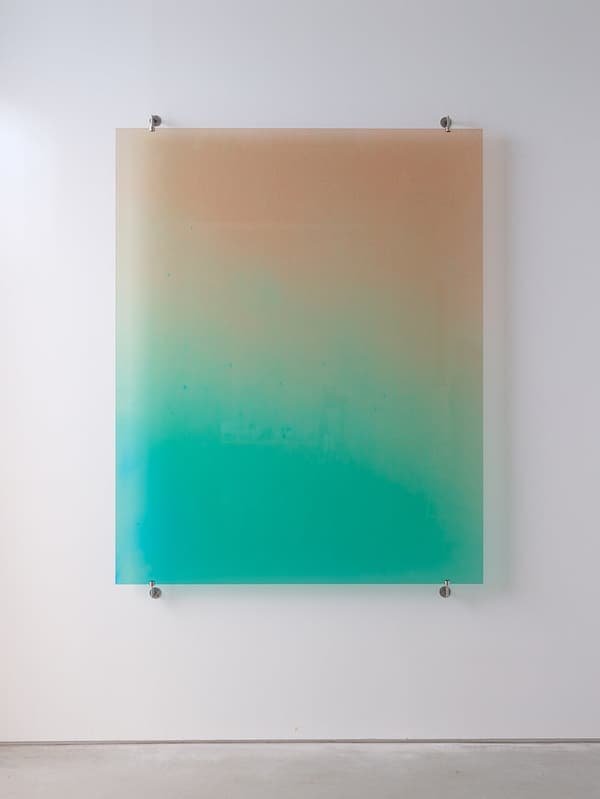 Zai Nomura, *Biophotons Shine So Brightly* (middle-aged mustached man in yellow swim trunks and sunglasses with a woman of similar age in a white bikini, on a beach crowded with swimmers, 1980), 2025, UV inkjet print on glass with stainless steel fittings, collection of the artist