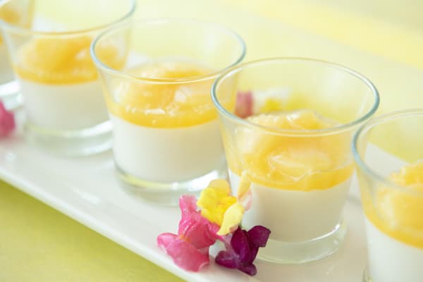 Smooth dessert with fruit sauce