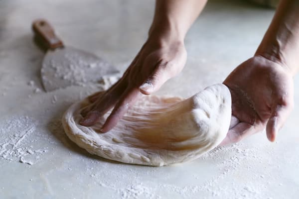 Morinapo stone oven pizza being prepared