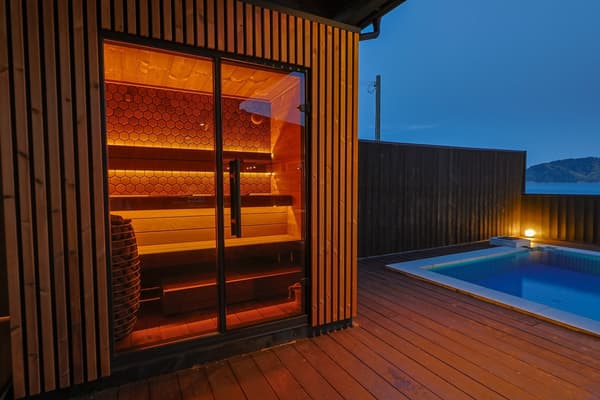 Outdoor sauna and relaxation area at KUON
