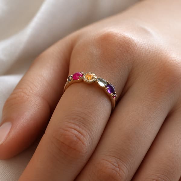 The glossy character of rounded gemstones, worn on the hand