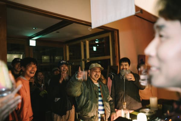 Guests raising their glasses at an event at C&C