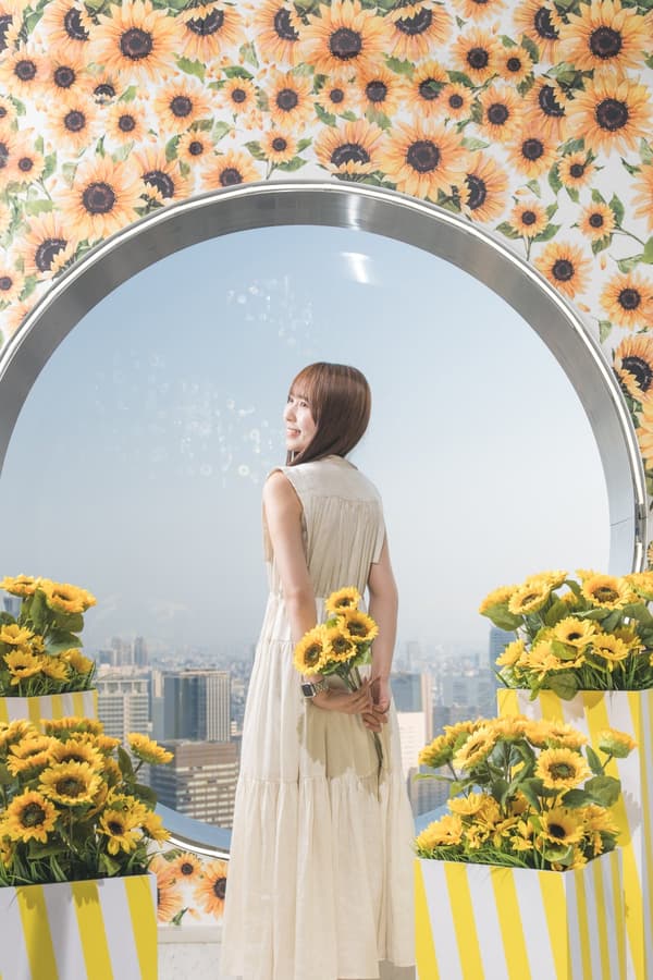The circular-window photo spot decorated with sunflowers for summer