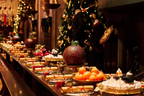 Presents and Christmas crackers on a table in the Great Hall