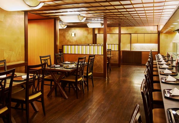 A counter for lively conversation, alongside relaxed table seating