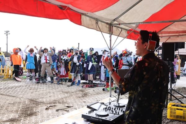 A DJ livening up the crowd with music at Snow Park Yeti