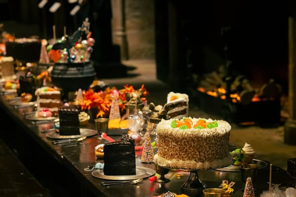 Tables filled with Halloween sweets and cakes in the Great Hall