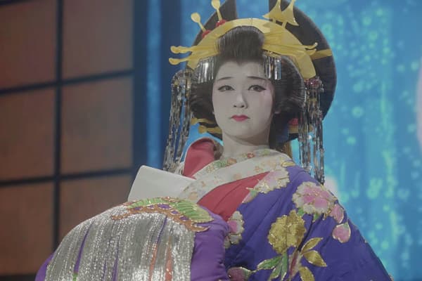 A performer in an elaborate oiran costume during the dance program