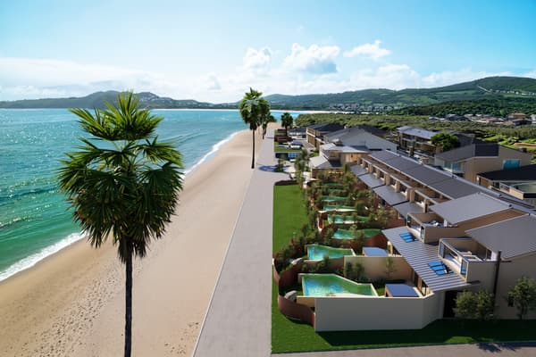 Onjuku Itsukiri, set beside the white sands of Onjuku Beach with the shoreline just steps away