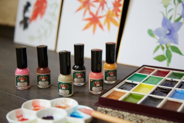 Gofun Nail bottles displayed next to Japanese-style painting pigments