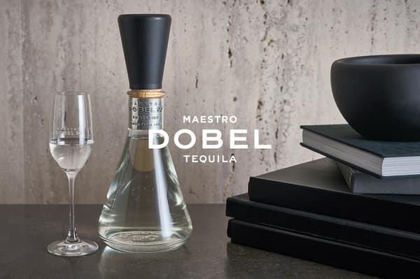 Dobel 50 Cristalino bottle and tasting glass with the Maestro Dobel Tequila logo