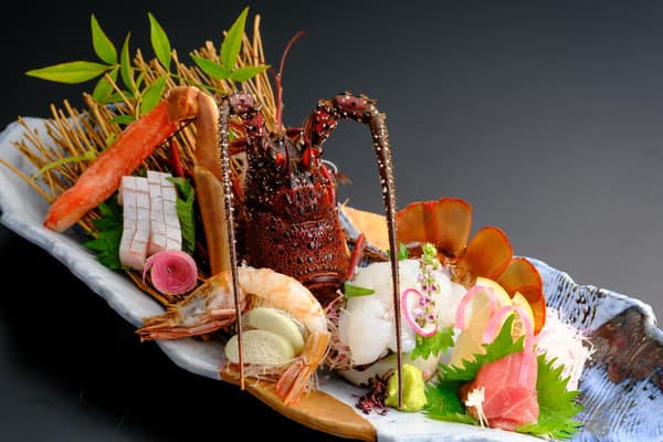 Assorted sashimi: Ise lobster, mosa-ebi, crab, and one other item