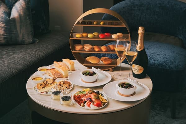 An elegant dinner enjoyed in the guest room, pairing fine food and drink with the fireworks lighting up the night sky