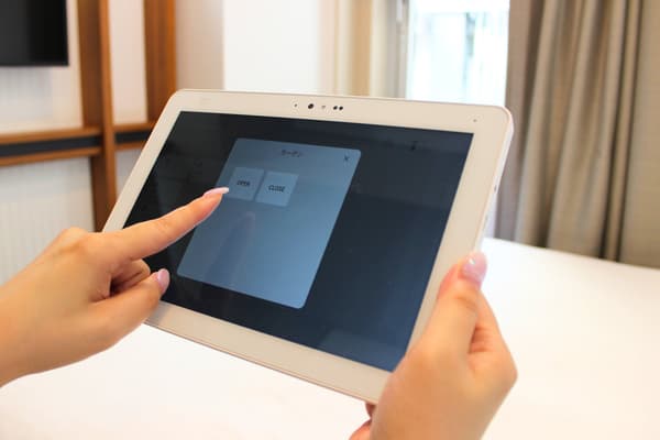 Tablet control panel used to operate the bed, lighting, and curtains