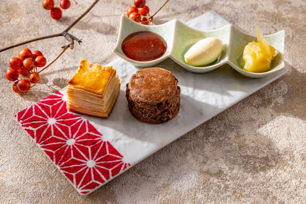 Two kinds of scones with three kinds of jam