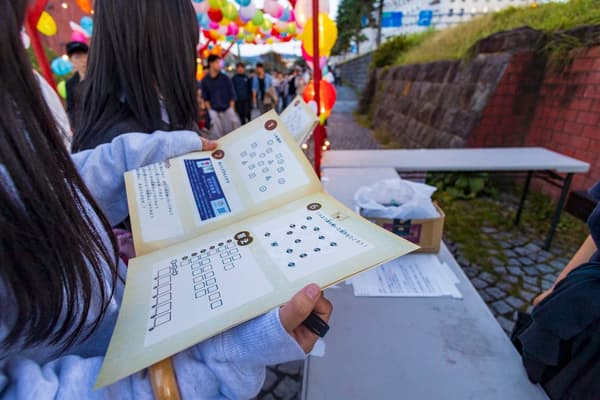 Music, lantern, and walking-game content at Kita Unga Night Market Yummy-ichi