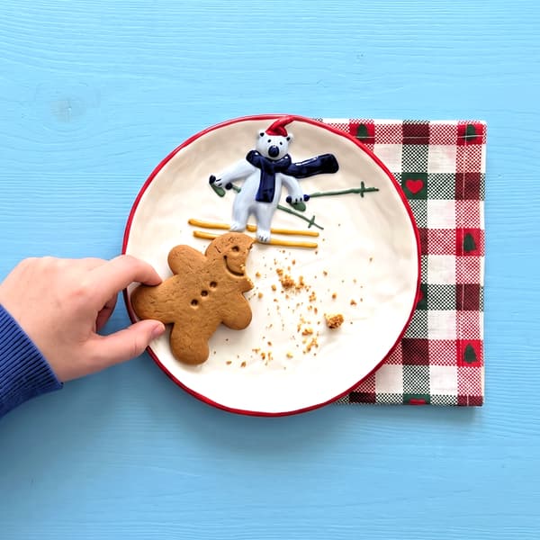 Polar bear skiing plate with a gingerbread cookie