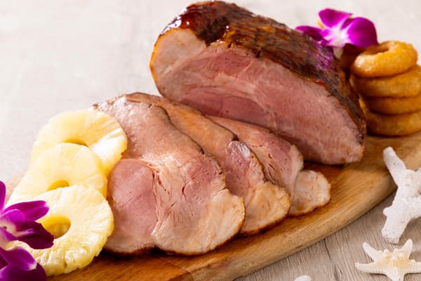 Hawaiian Roast Pork with Polynesian Sauce, carved tableside by the chef