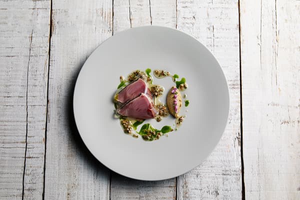 Seared Kanto Modorigatsuo with JW Garden herb oil, Waseda myoga, and Tokyo eggplant