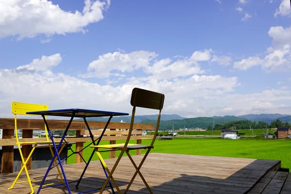 A wood deck that opens onto the rice paddies — quiet at night