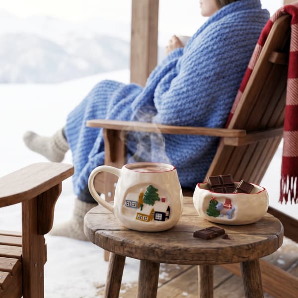 Mug and bowl styled together in a winter setting