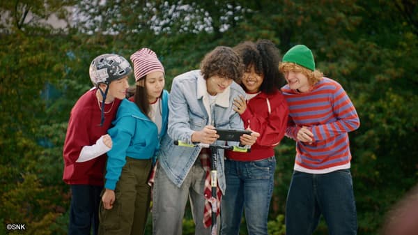 Friends enjoying the game together outdoors on Nintendo Switch 2