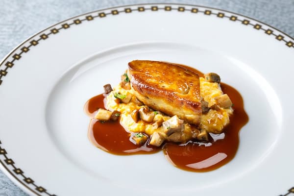 Foie Gras Poêlée with Scrambled Eggs, Sautéed Mushrooms, and Madeira Sauce