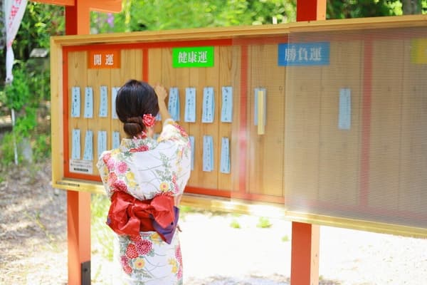 Tanzaku wishes offered at the statue