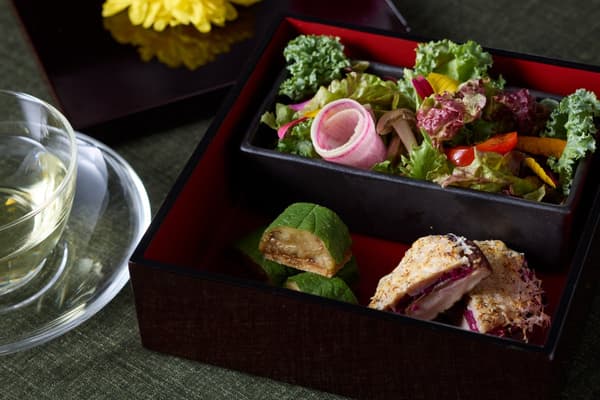 Savory dishes in a chrysanthemum-decorated tiered box