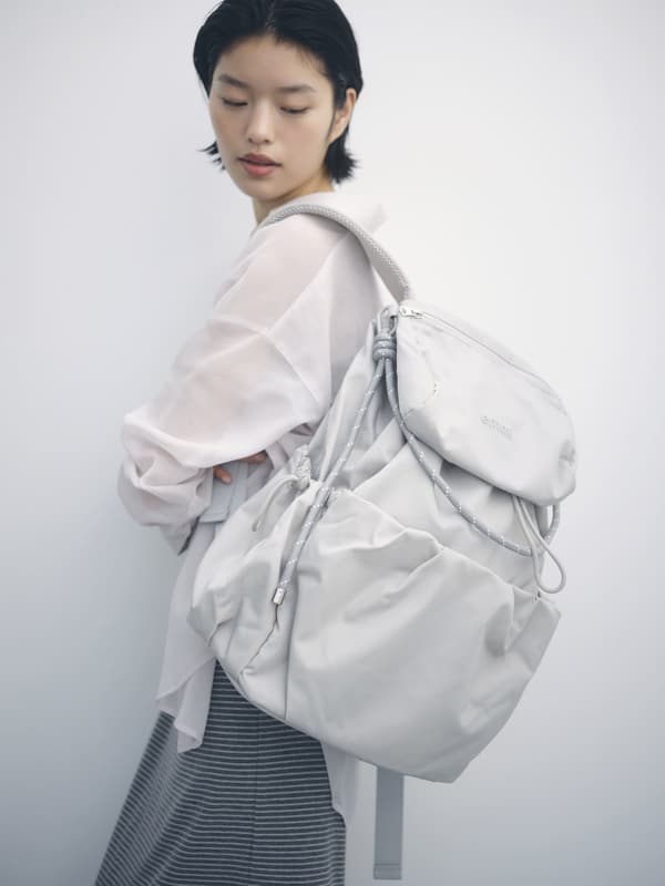 Multi-use backpack in distribution-limited gray