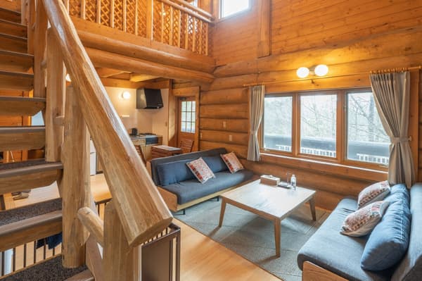 Interior of a log house at STAR COTTAGE ACHI