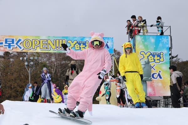 A participant in costume snowboarding at Snow Park Yeti