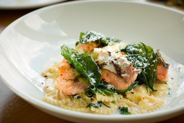 Grilled Fuji Atlantic Salmon with spinach farfalle in spicy cream sauce