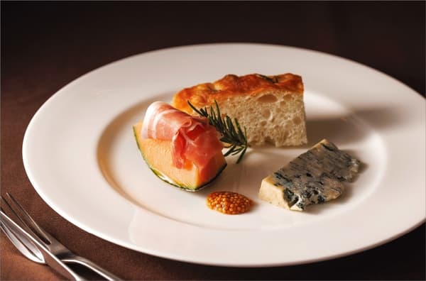 Aged cheese and charcuterie with autumn melon and fermented focaccia