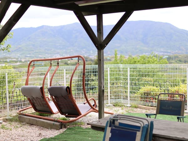 View of the mountains and Kinokawa River from the swing seating at Sky Site