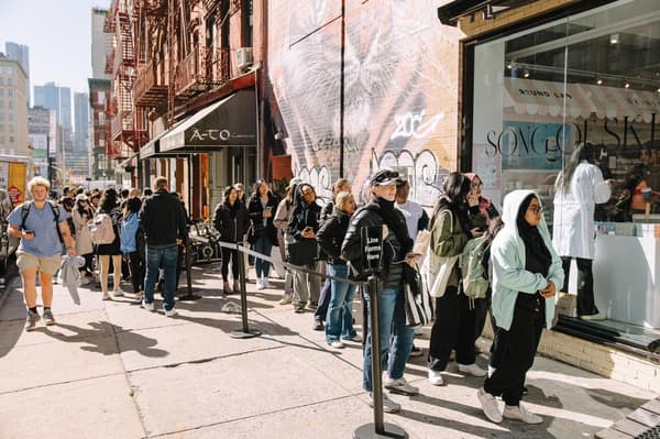 Visitors lining up outside the SONG OF SKIN pop-up in New York
