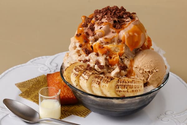 Caramel Banana Chocola and Berry Pistachio parfait shaved ice side by side