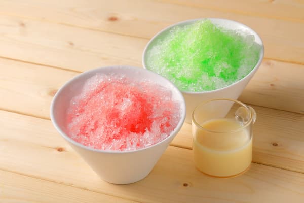 Self-serve shaved ice with red and green syrup