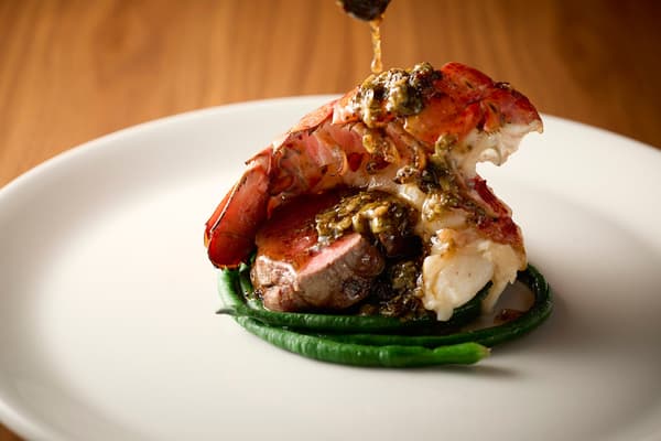 Grilled wagyu fillet and lobster tail with roasted garlic and chili lemon butter